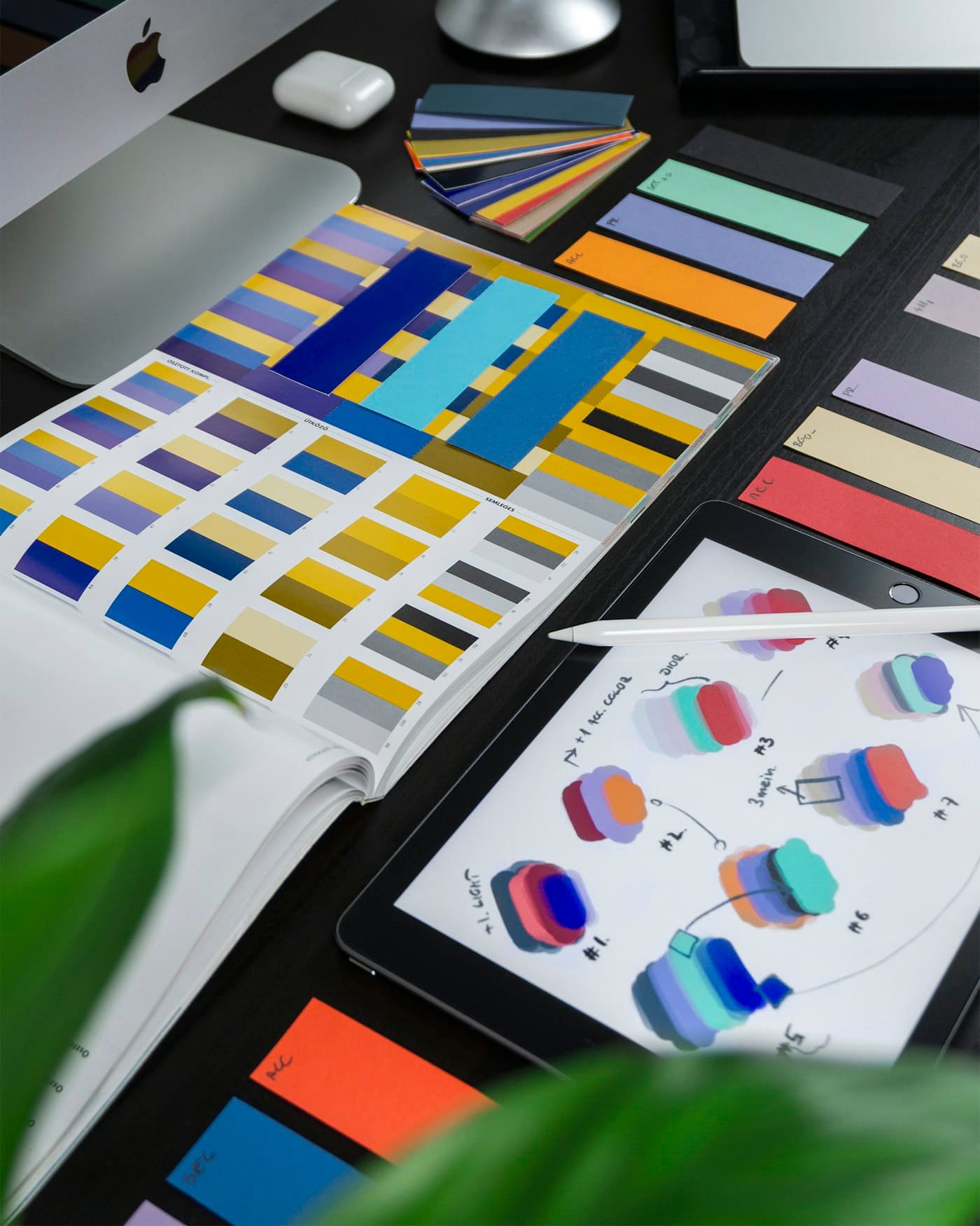 Colour swatches and design tools on a studio desk